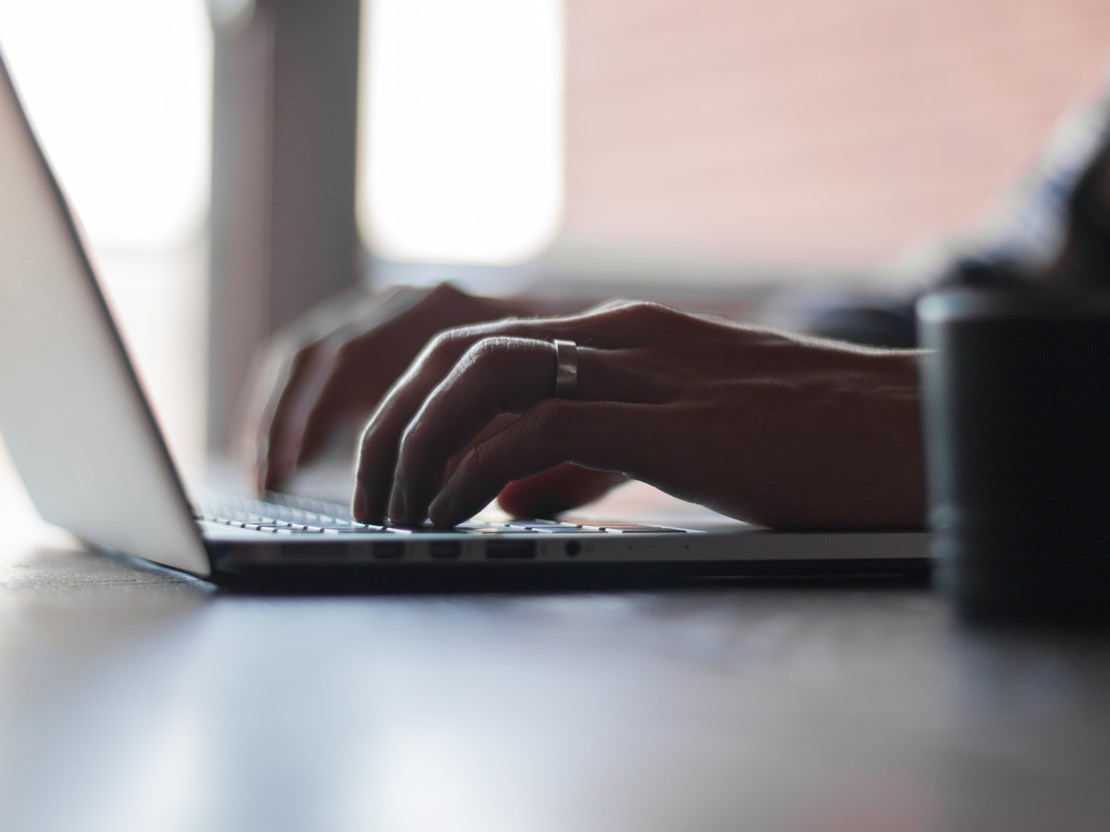 Person typing on laptop