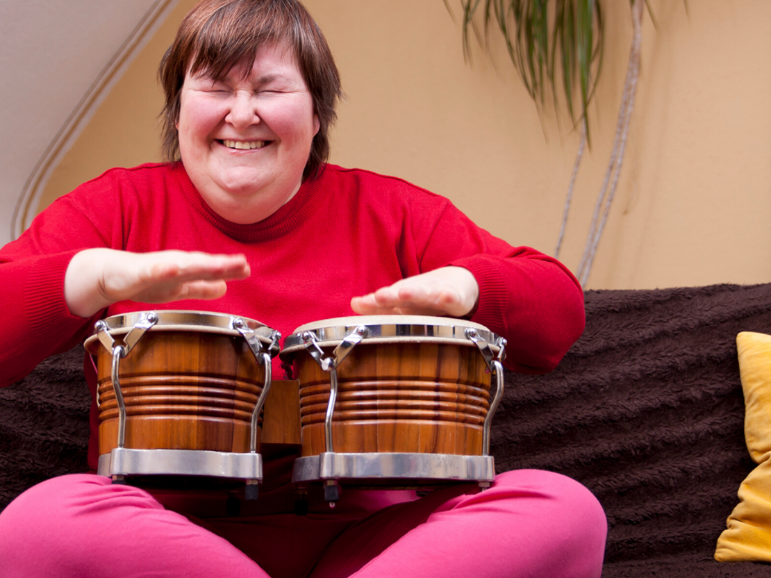 Woman playing bongo drums 