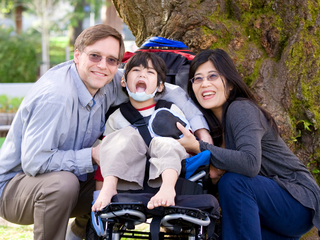 Family with child on a wheelchair