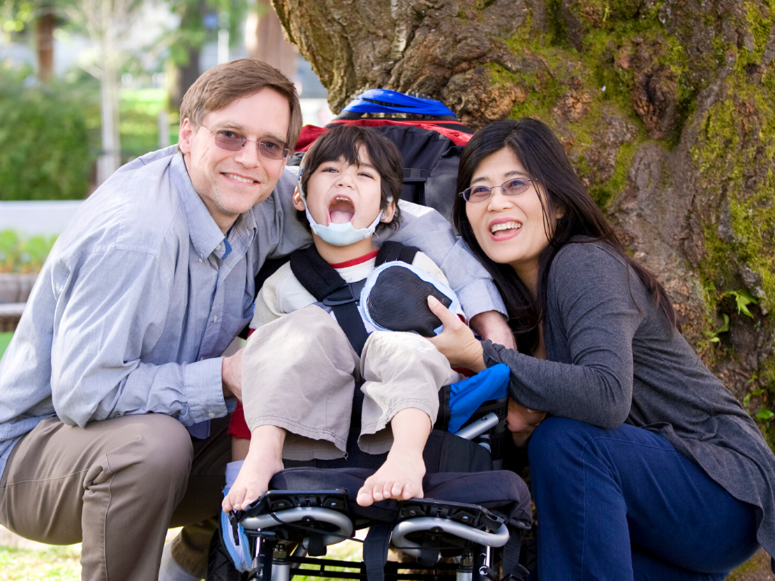 Family with child on a wheelchair 