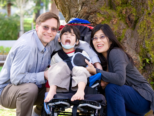Family with child on a wheelchair 