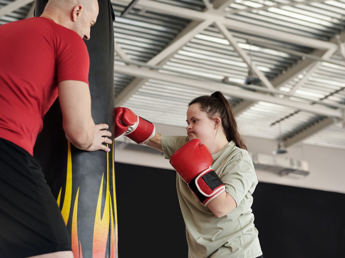 Young woman at gym boxing
