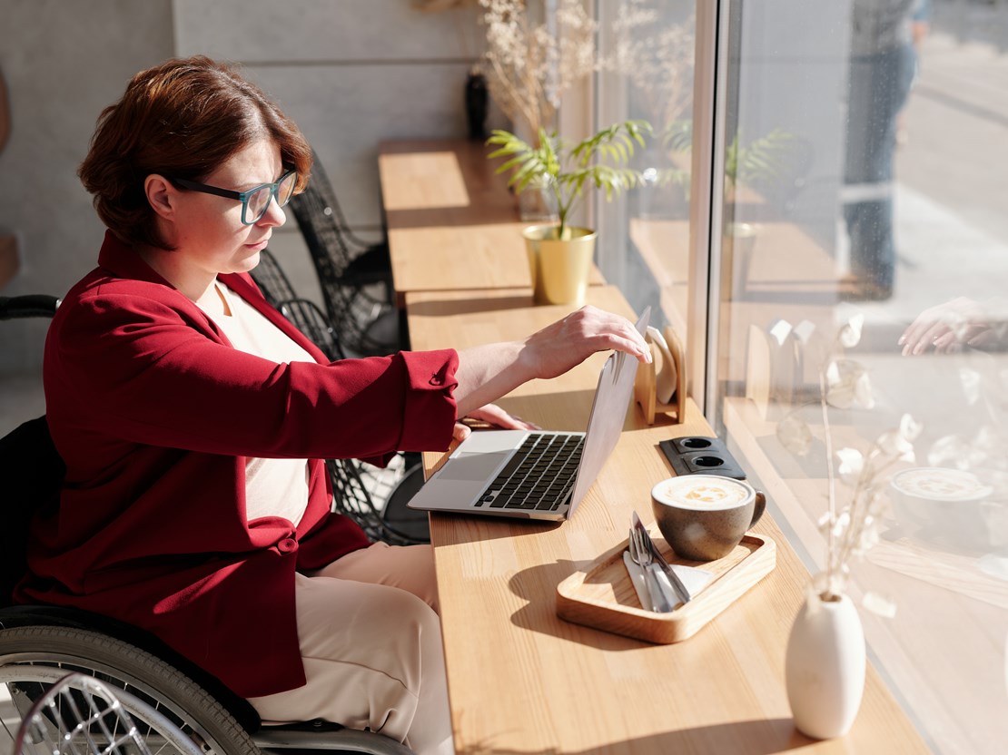 Wheelchair user closing her laptop.jpg