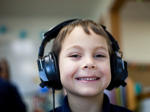 Smiling young boy wearing headphones.jpg