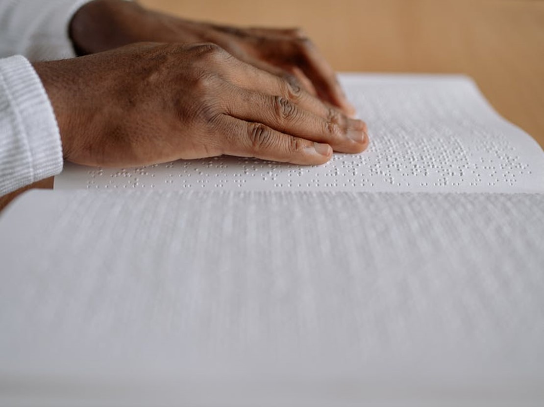 Hand reading braille.jpeg