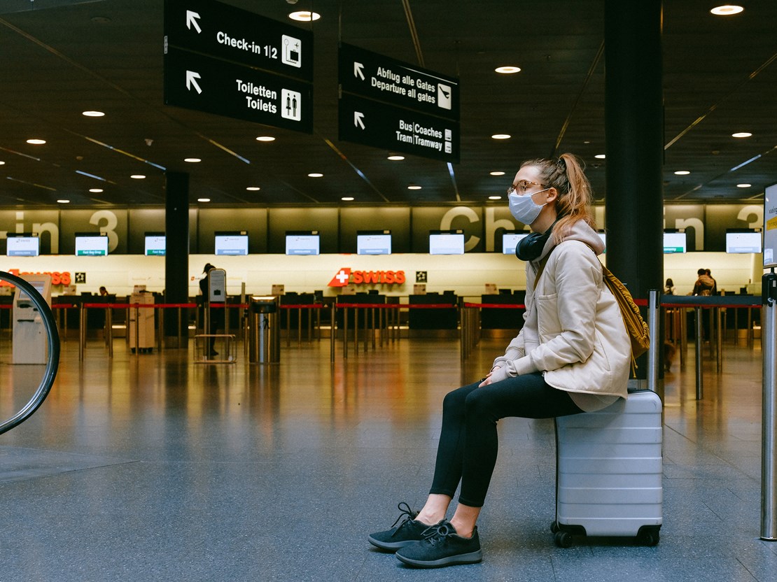 Woman wearing facemask at airport.jpg