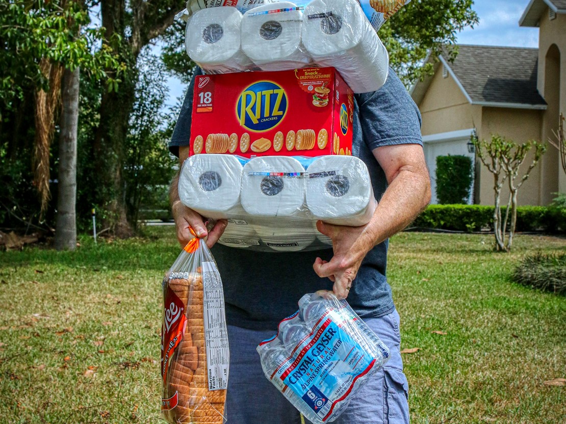 Man carrying essential supplies.jpg